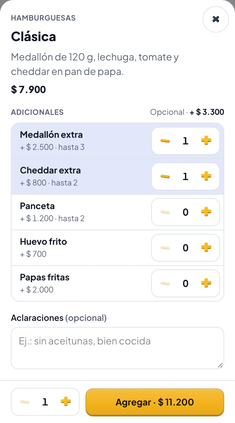 La ficha de una hamburguesa en la tienda, con medallón extra y cheddar elegidos y el precio actualizado.